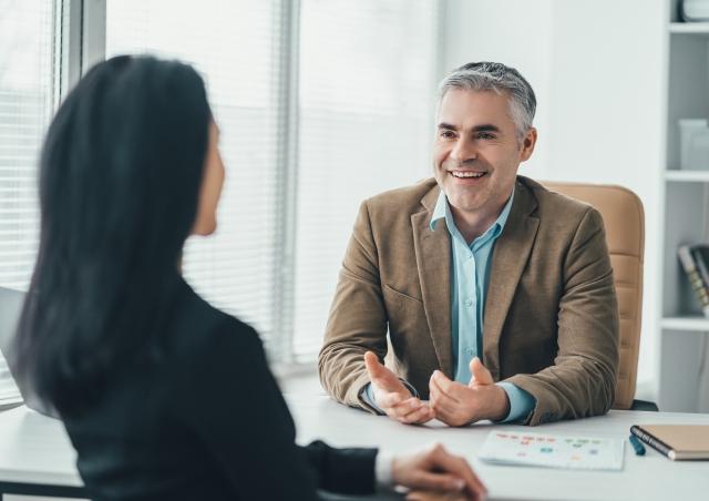 Professional talking at desk